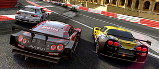 racing cars on concrete road during daytime