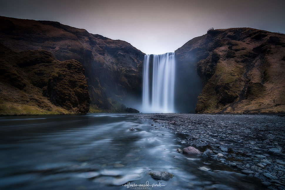 waterfalls between rock formation HD wallpaper