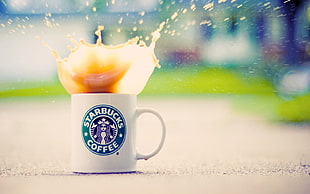 white Starbucks ceramic mug, coffee, splashes