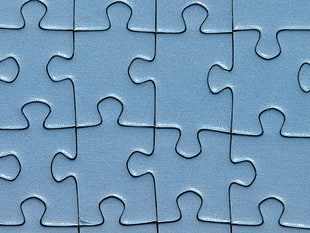 closeup photo of teal jigsaw puzzle