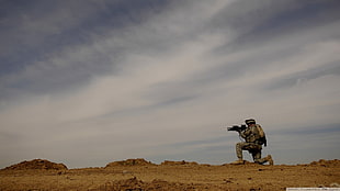 men's brown top, soldier, AR-15