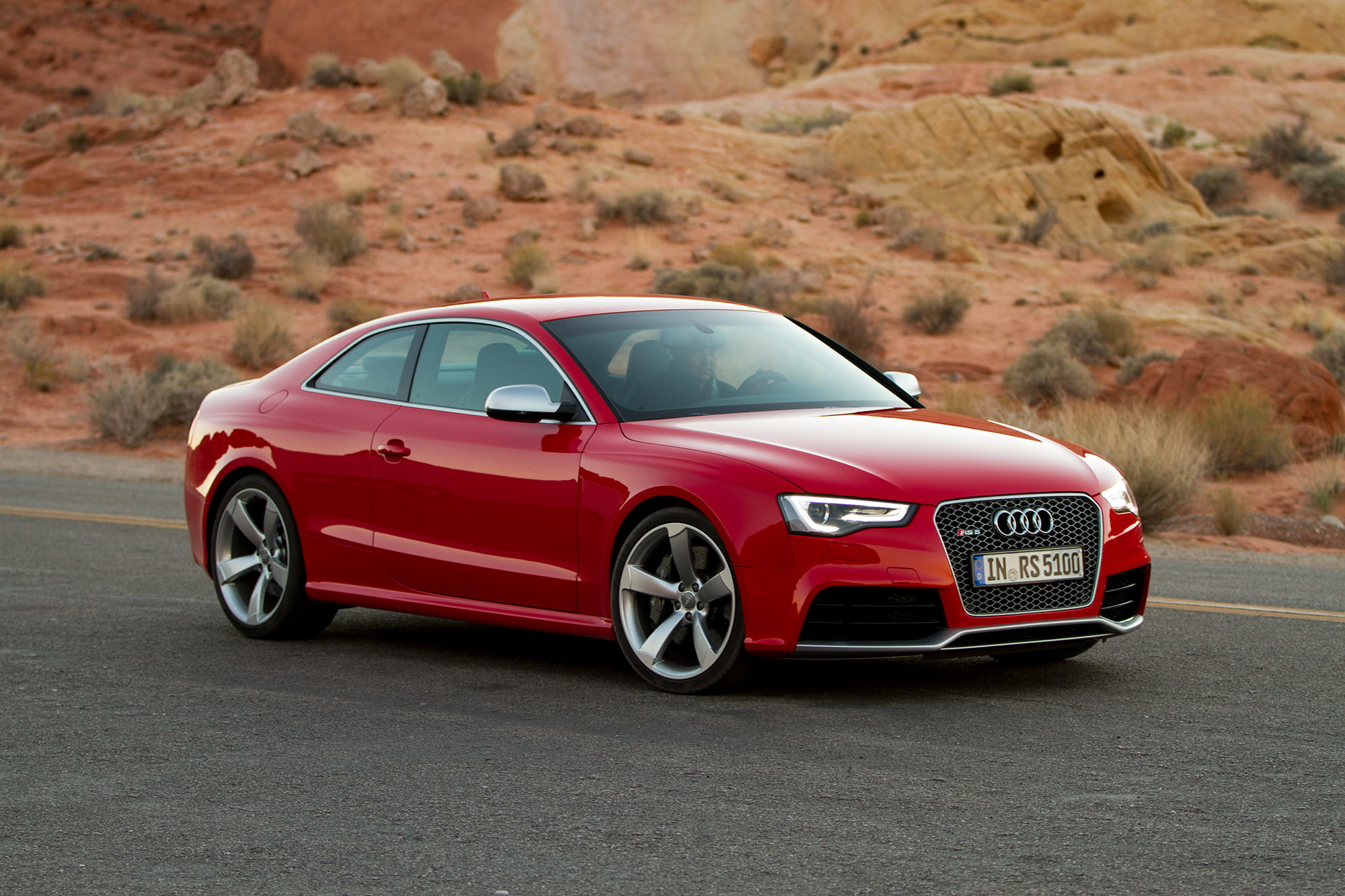 red Audi coupe  on road