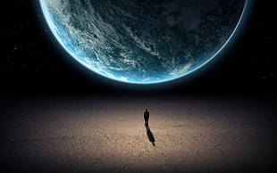 photo of person walking through moon