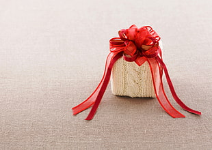 white and red knitted gift box