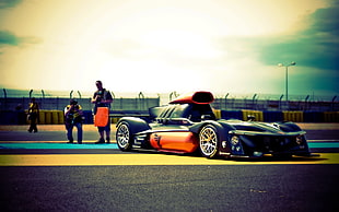 black and orange racing car, race cars, sports, vehicle HD wallpaper