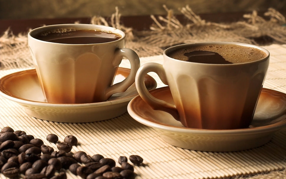 two brown ceramic cups and saucers on brown surface HD wallpaper
