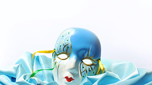 white and blue masquerade mask