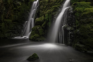 two waterfalls in forest