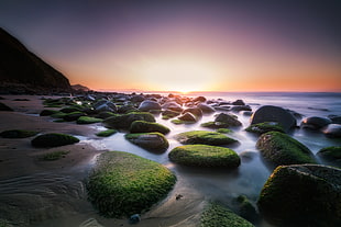 rocky beach sunset themed photo HD wallpaper