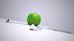 white earbuds and green apple, apples, technology