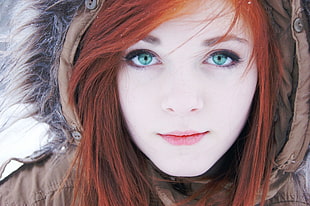 women's brown furlined parka jacket, face, winter, redhead, blue eyes