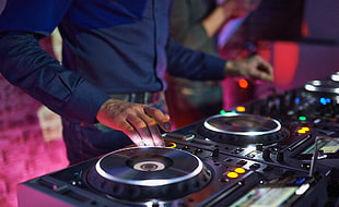 man playing DJ controller