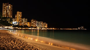 body of water, night, beach, lights, clouds HD wallpaper