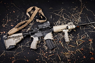 beige and black assault rifle