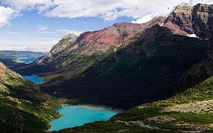 aerial shot of mountain and body of water