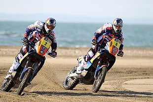 two man riding Motocross dirt bikes at daytime HD wallpaper