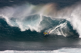 man on surfboard gliding on a giant wave, gran canaria