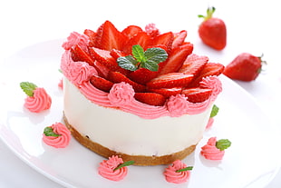 sliced strawberries on cake