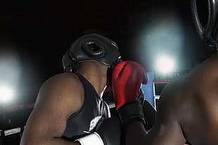 Man wearing black leather boxing head gear