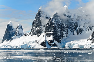 view of  mountain coated with ice during daytime