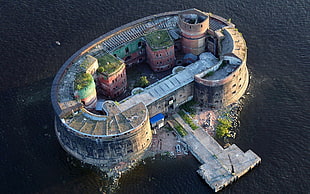 bird's-eye view photography of castle surrounded with body of water
