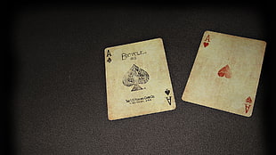 one Ace of Spade and one Ace of Heart playing cards HD wallpaper