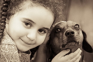 girl holding dachshund puppy