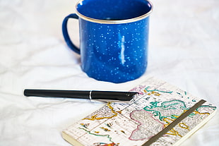 blue ceramic mug, Notebook, Pen, Cup