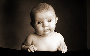 closeup photography of topless baby
