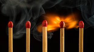 time-lapse photo of matchsticks burning
