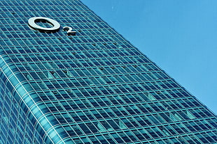 low-angle photography of O2 high-rise glass curtain building