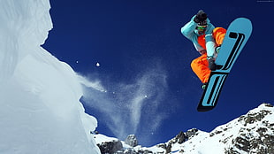 man in orange pants riding snowboard HD wallpaper