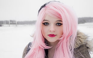 pink haired woman posing for picture