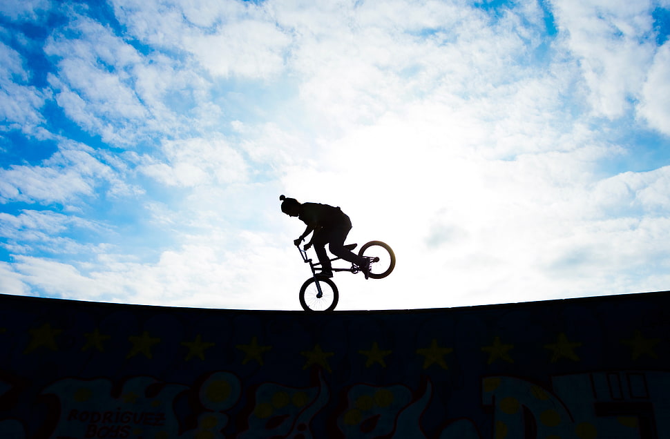 photo of silhouette of person using BMX bike HD wallpaper