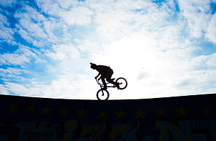 photo of silhouette of person using BMX bike HD wallpaper