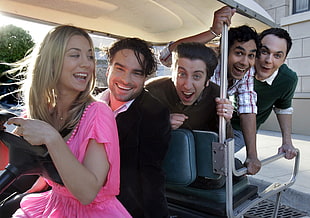 group of person on a golf cart during day tim