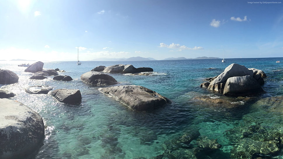 grey stone near body of water during daytime HD wallpaper