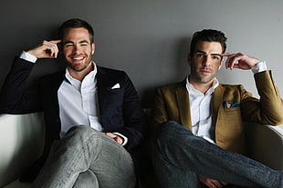 two men's sitting on sofa HD wallpaper