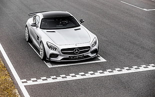 white Mercedes-Benz SLS on black asphalt road