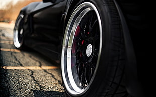 black car wheel with tire, car