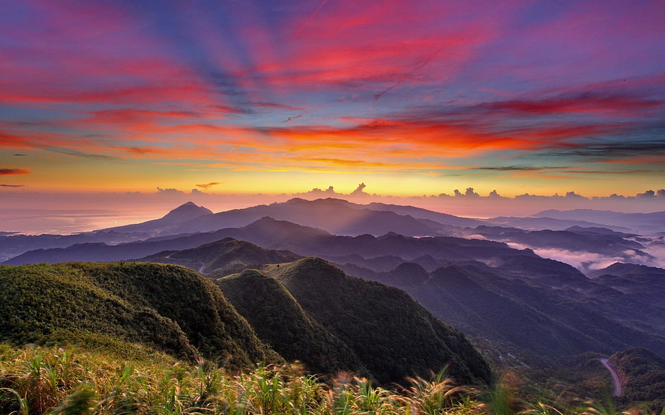 scenery of mountain ranges during sunset HD wallpaper