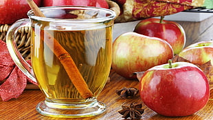 clear glass teacup beside red apple fruit HD wallpaper