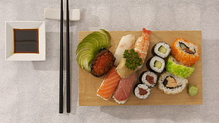 sushi and sliced food on brown plate HD wallpaper
