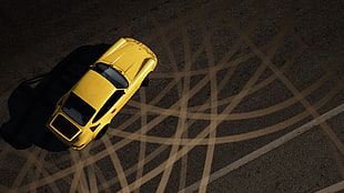 yellow coupe on concrete road