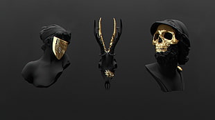 three assorted black-and-gold sculptures, skull, gold