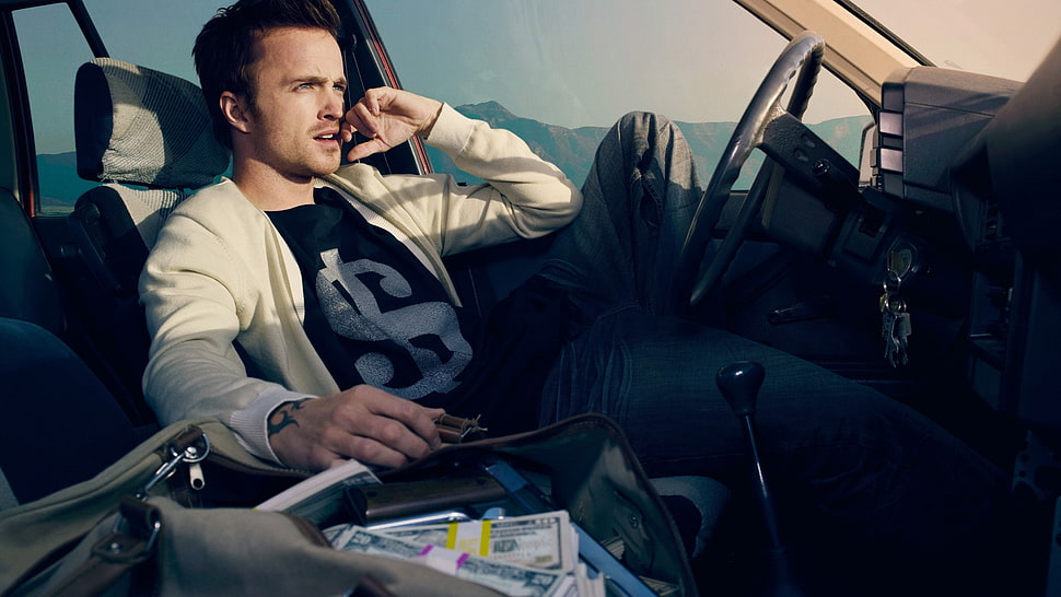 man sitting on car seat while staring at the window HD wallpaper