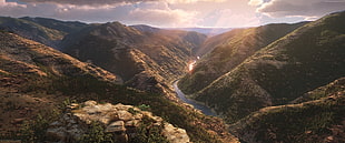 river cutting through the mountain ranges at daytime HD wallpaper