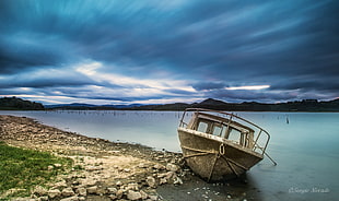 white boat on body of water under blue sky during daytime HD wallpaper