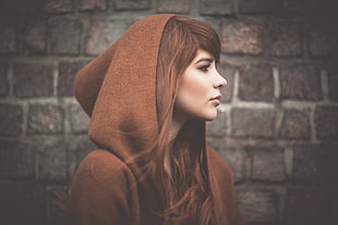 woman wearing brown hdoohood