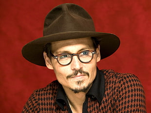 person wearing brown hat with eyeglasses
